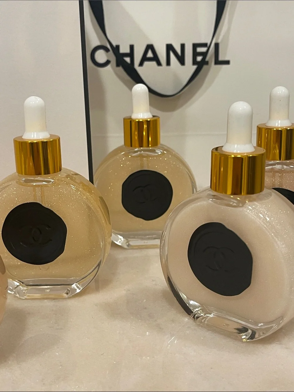 CHANEL Illuminating Shimmering Body Oil Fragrance Drop Bottles.